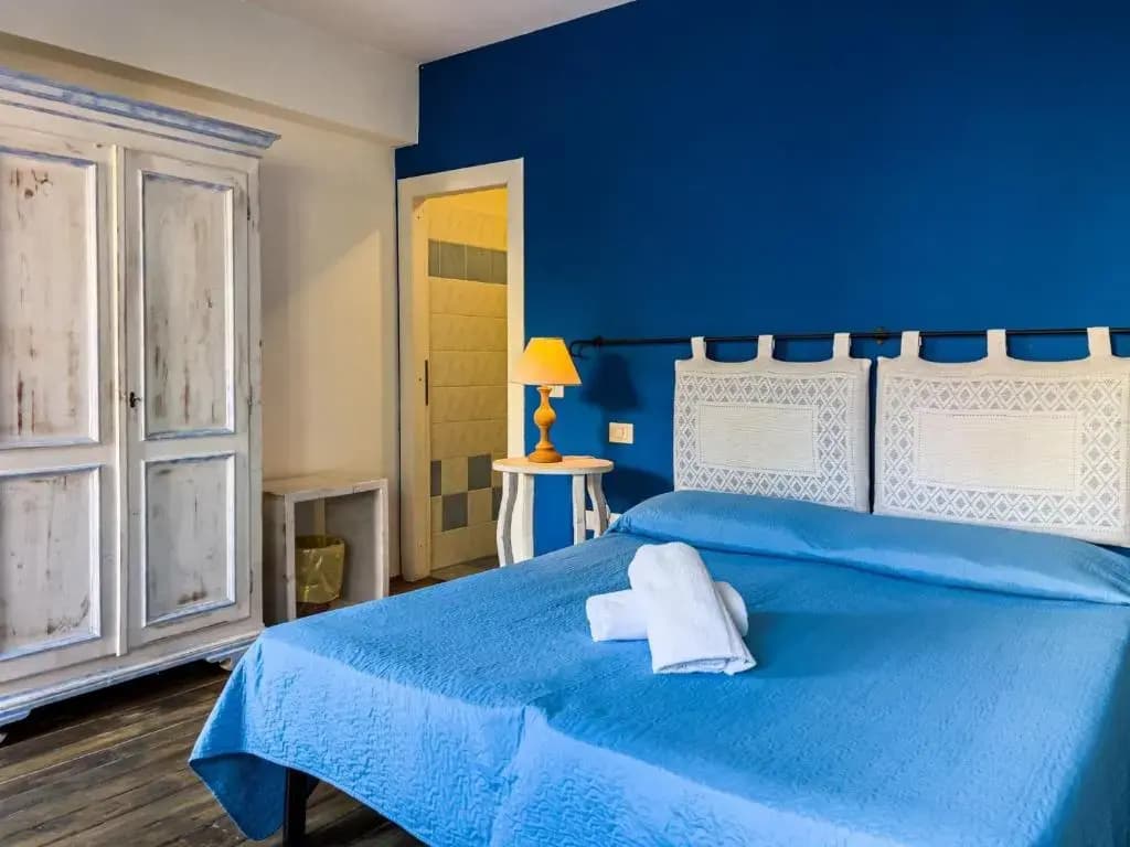 Standard Quadruple room with garden view