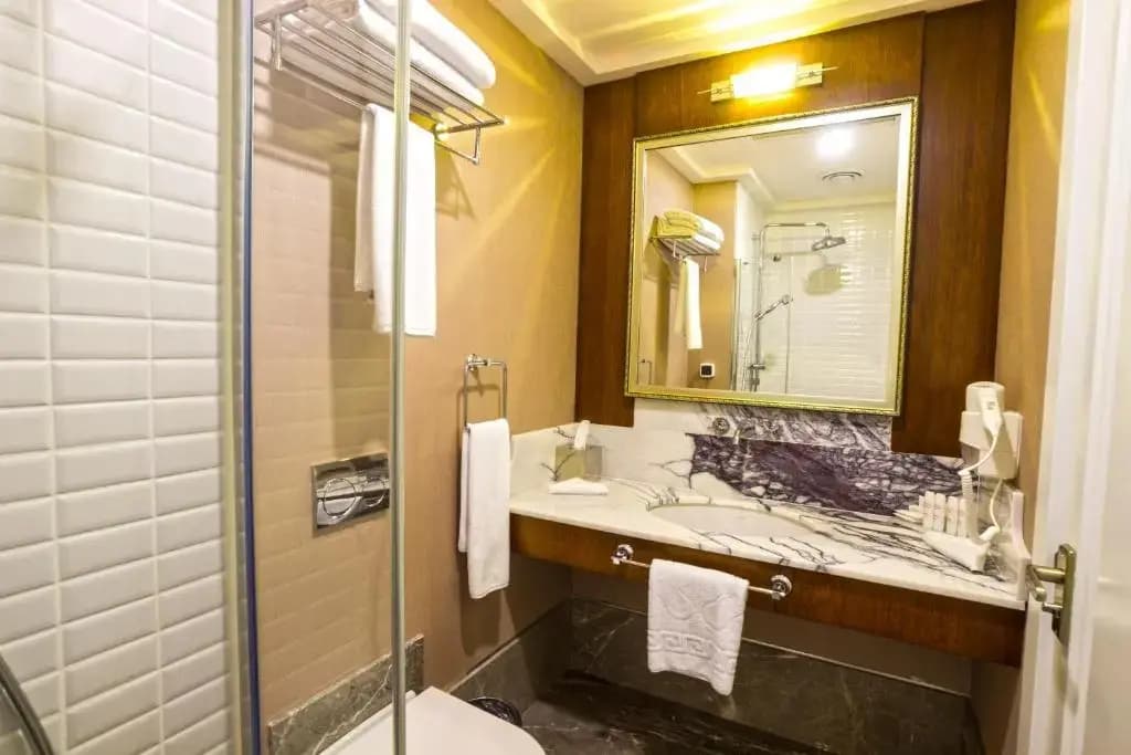 Deluxe Triple room with balcony and with sea view
