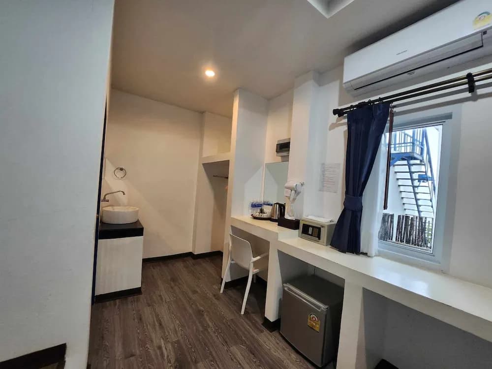 Standard Triple room with garden view