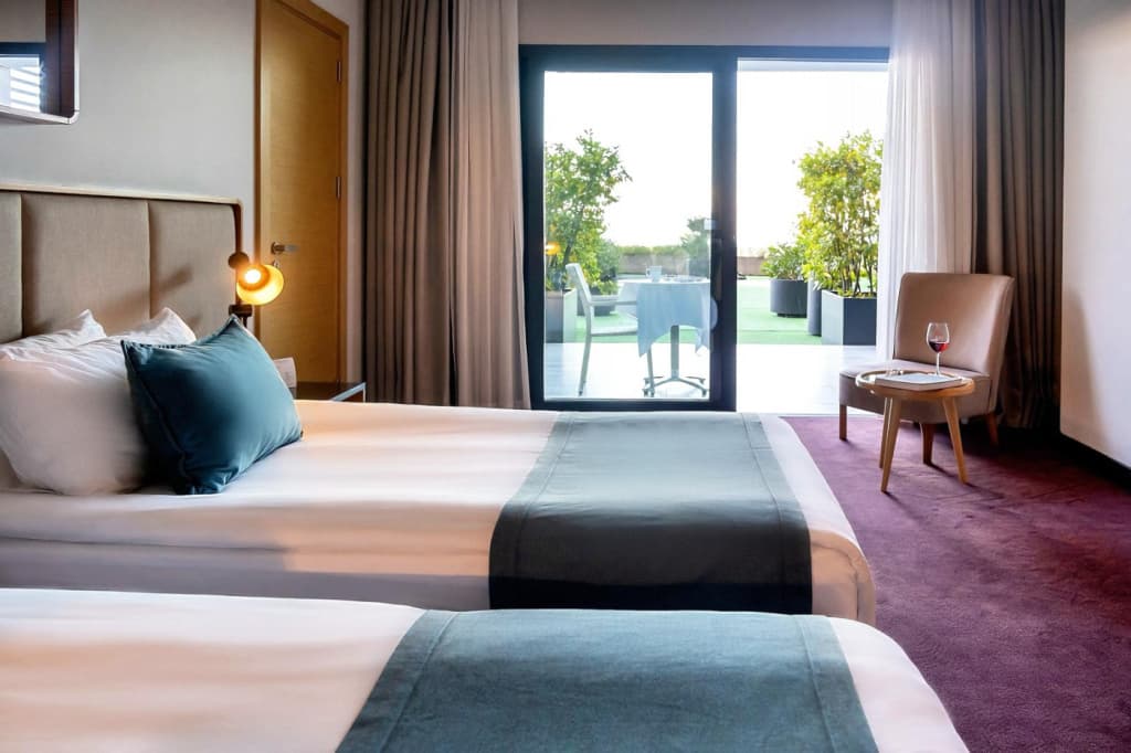 Deluxe room with balcony and with garden view