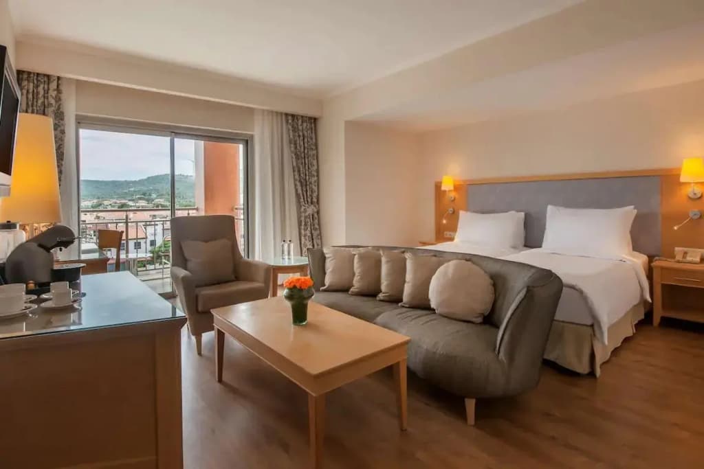Double Junior Suite with balcony and with pool view full double bed