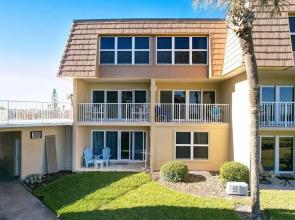 Beachfront Gem: Serene 2BD Haven With Pool & Views