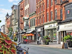 1850s historic Row House 7min train to NYC with private backyard