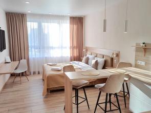 V Tsentre Goroda Apartments